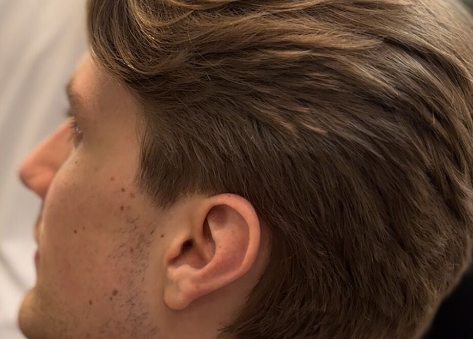 Side profile of a man's haircut at HairbyLiam, Lara, Victoria, AU showcasing sleek styling.