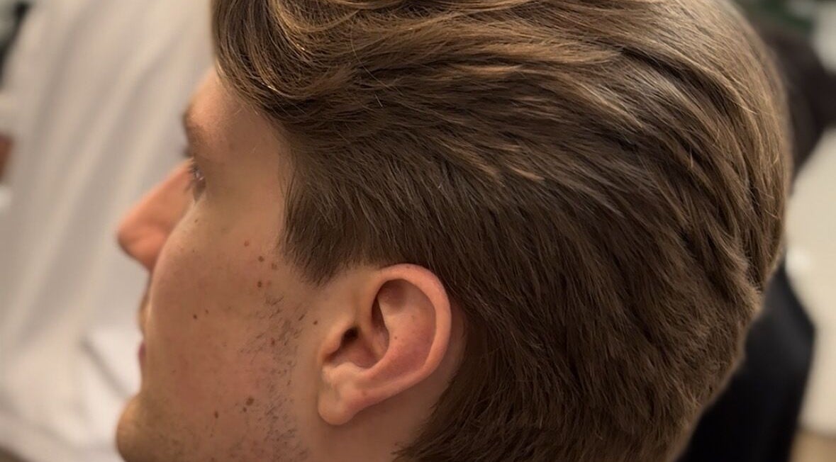 Side profile of a man's haircut at HairbyLiam, Lara, Victoria, AU showcasing sleek styling.
