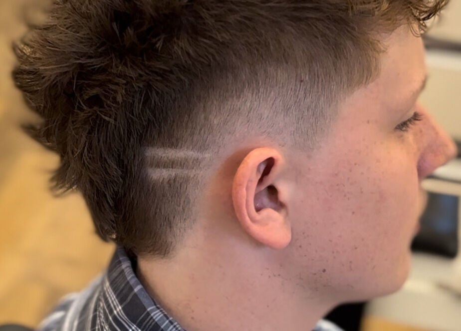 Modern sidecut hairstyle at HairbyLiam in Lara, Victoria, AU showcasing detailed clipper work.