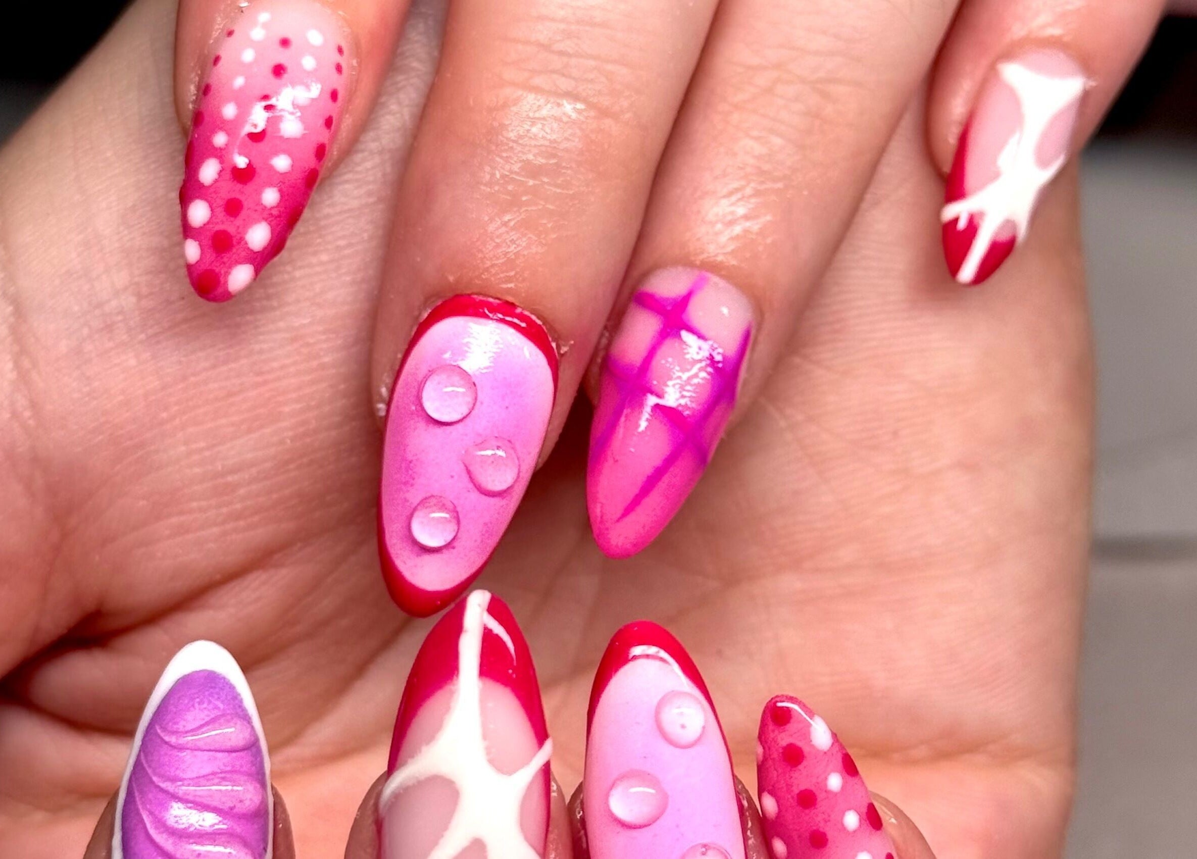 Vibrant pink and red nail art at Nails by Eden in Murrumba Downs, Queensland, AU.