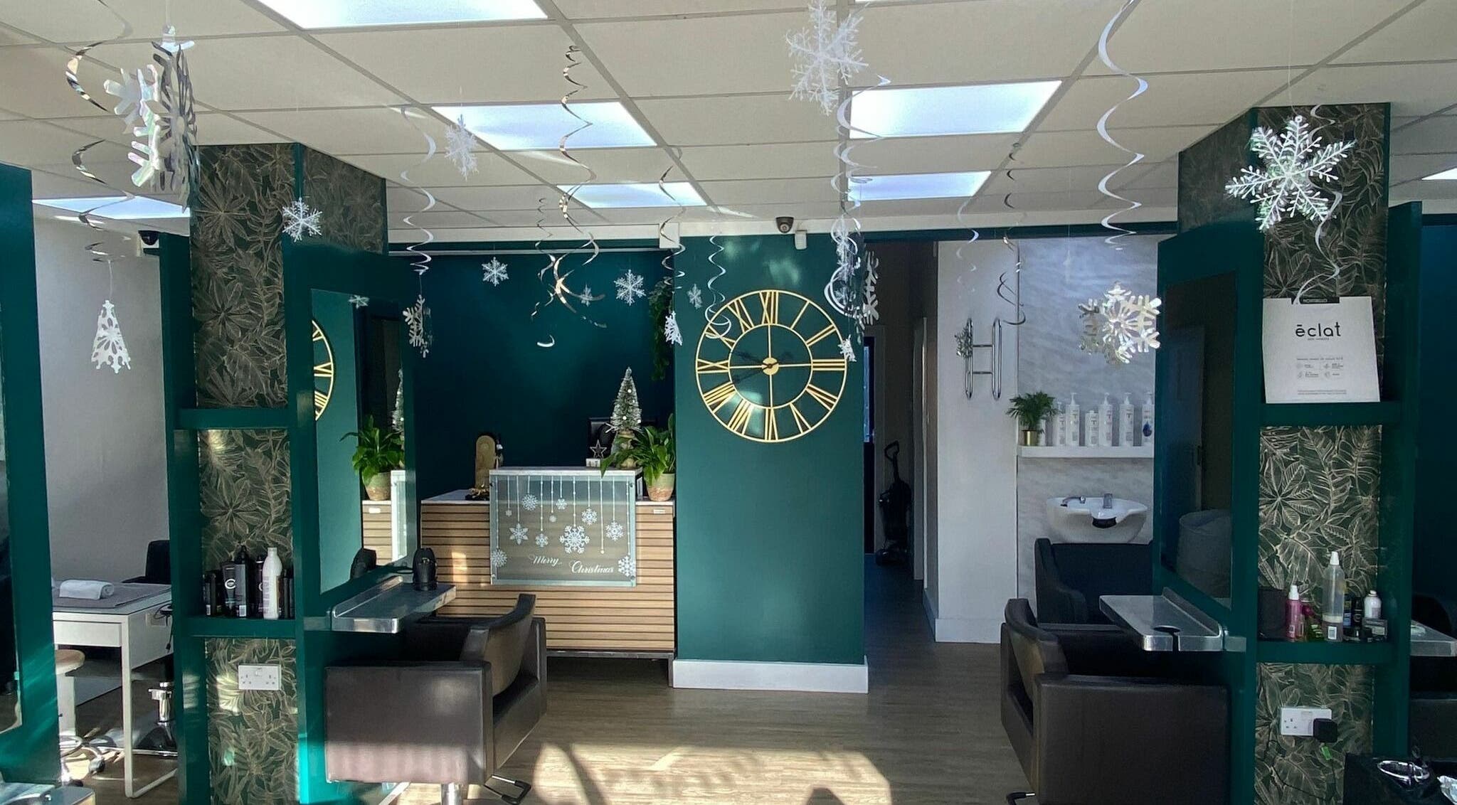 The Hair and Beauty Edit Ltd in Gosport, England showcases a stylish, festive interior with green decor and snowflake accents.