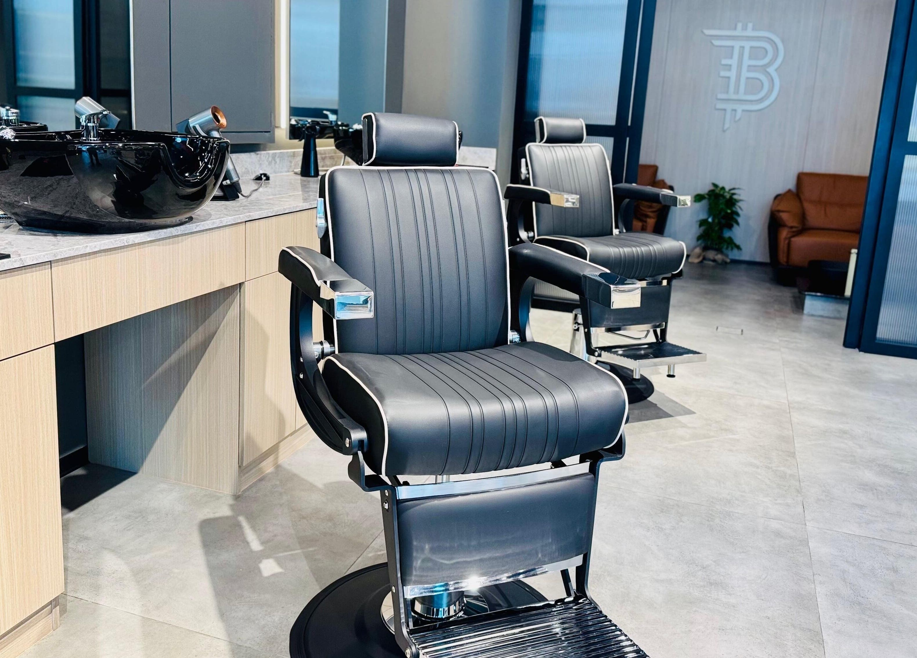 Modern barber chairs at B27 Barbershop, Dubai, AE, showcasing elegant and comfortable design.
