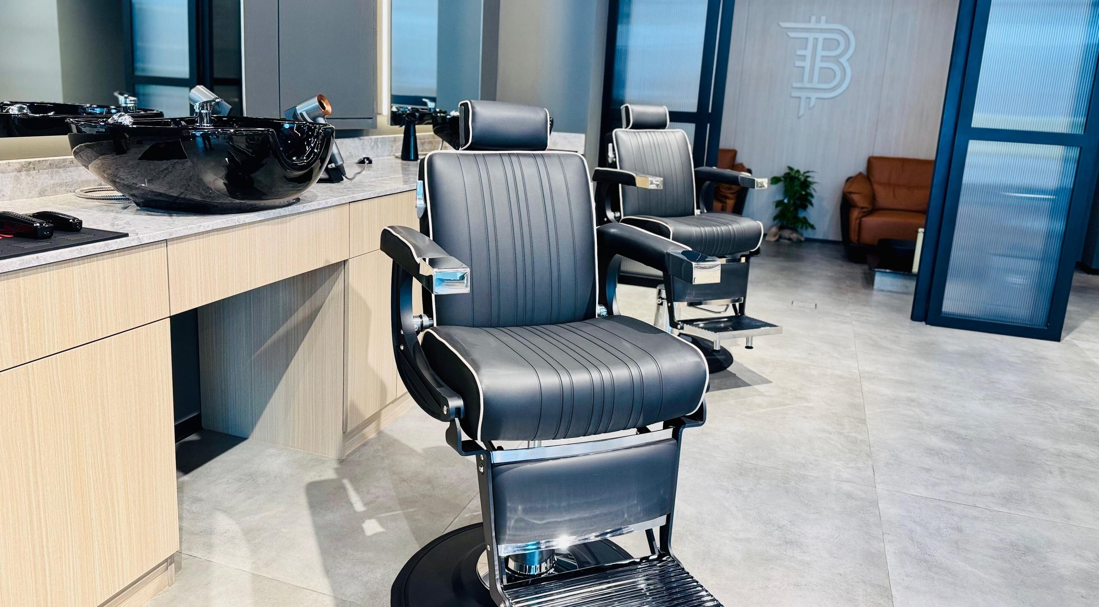 Modern barber chairs at B27 Barbershop, Dubai, AE, showcasing elegant and comfortable design.