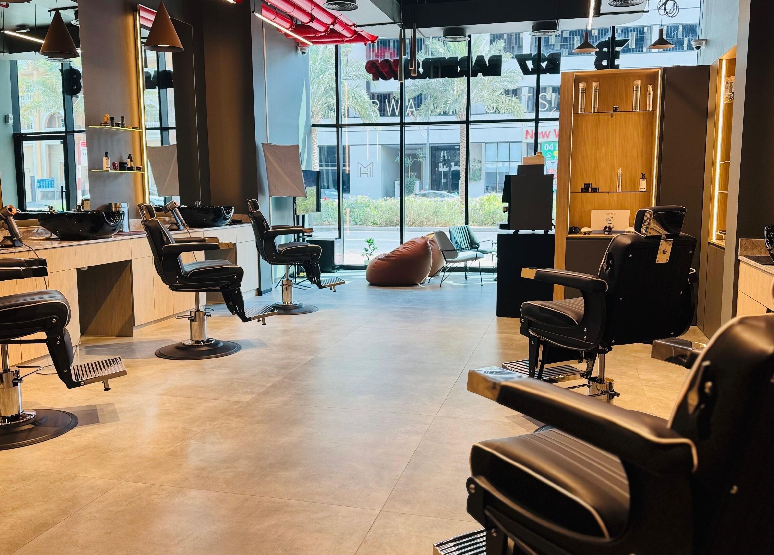 Interior of B27 Barbershop in Dubai, AE with modern barber chairs and stylish decor.