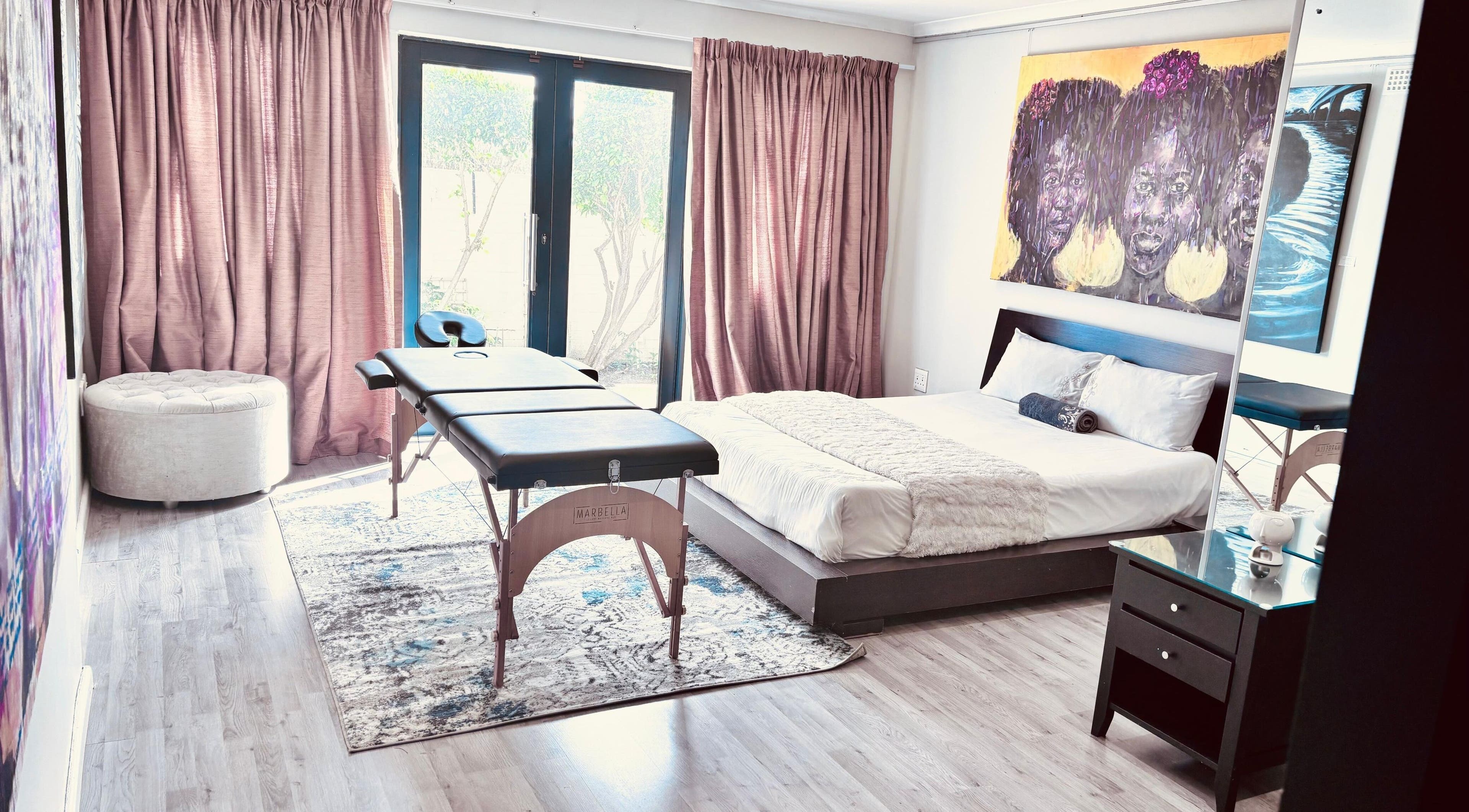 Serene treatment room at Chalila Wellness, Cape Town, Western Cape, ZA with cozy bed and massage table.