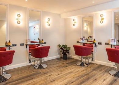 Modern salon chairs and mirrors at bei London, London, England, GB offering premium beauty services.