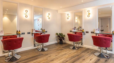 Modern salon chairs and mirrors at bei London, London, England, GB offering premium beauty services.