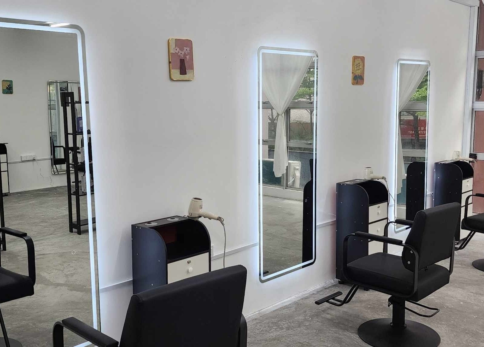 Modern salon interior at PLAN A HAIR SALON in Masai, Johor, MY featuring sleek styling stations and chairs.