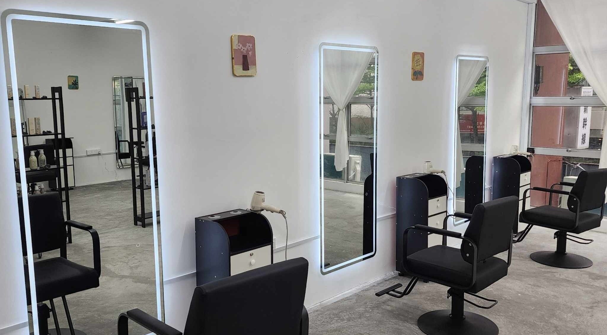 Modern salon interior at PLAN A HAIR SALON in Masai, Johor, MY featuring sleek styling stations and chairs.