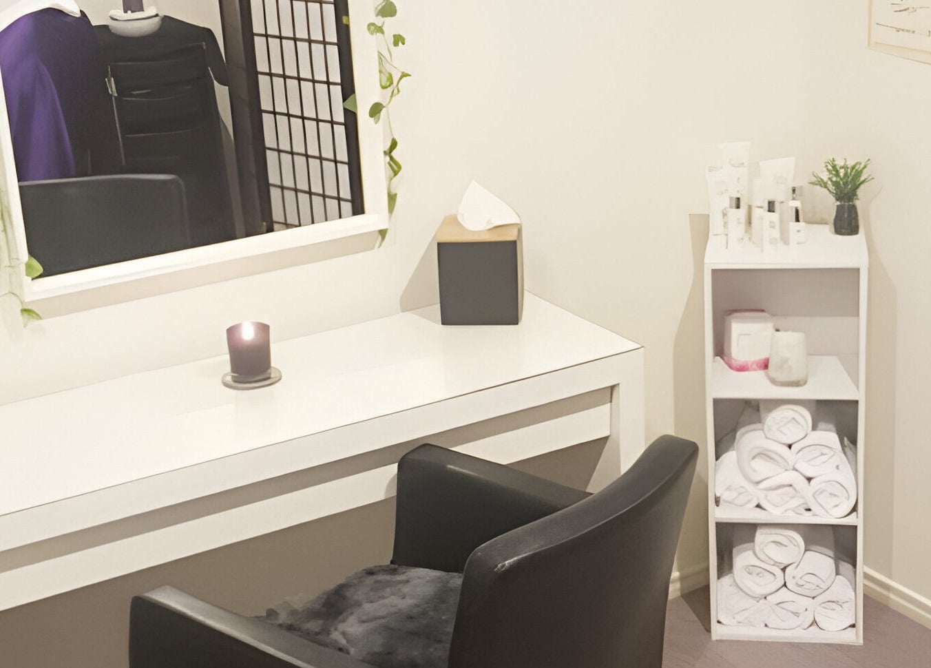 Relaxing treatment room at Bliss Beauty Bar, Strathpine, Queensland, AU with cozy decor and soothing candlelight.