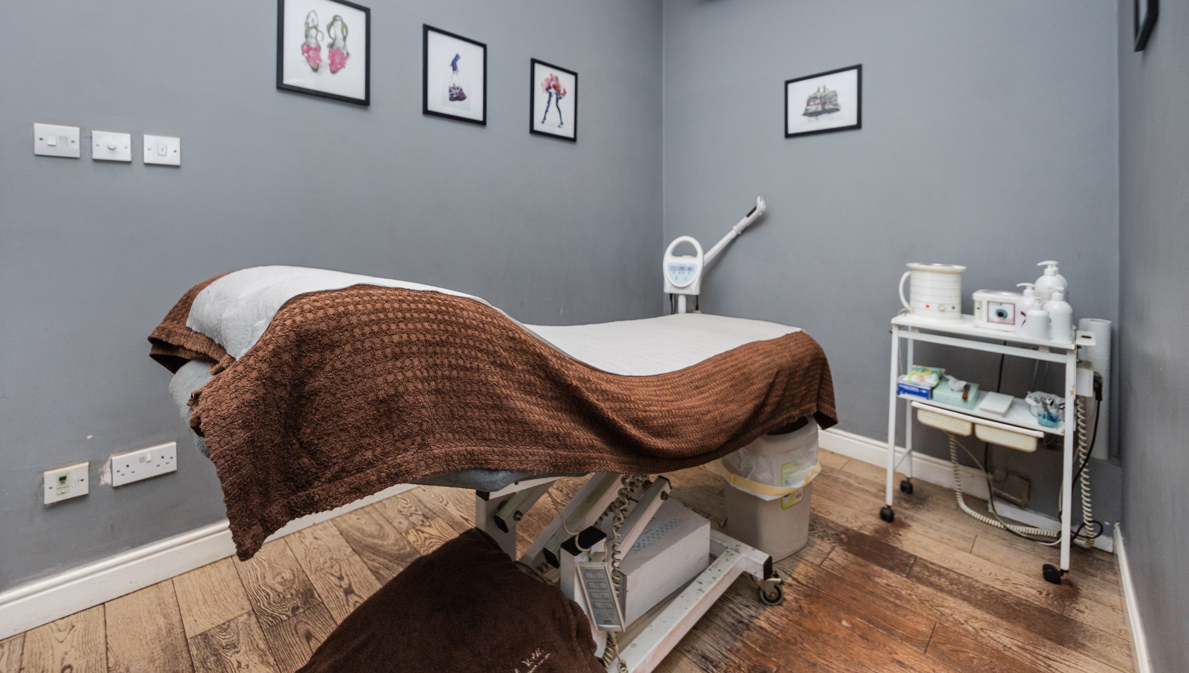 Calm treatment room at Brigita Vather, London, England, GB with a therapy bed and subtle decor.