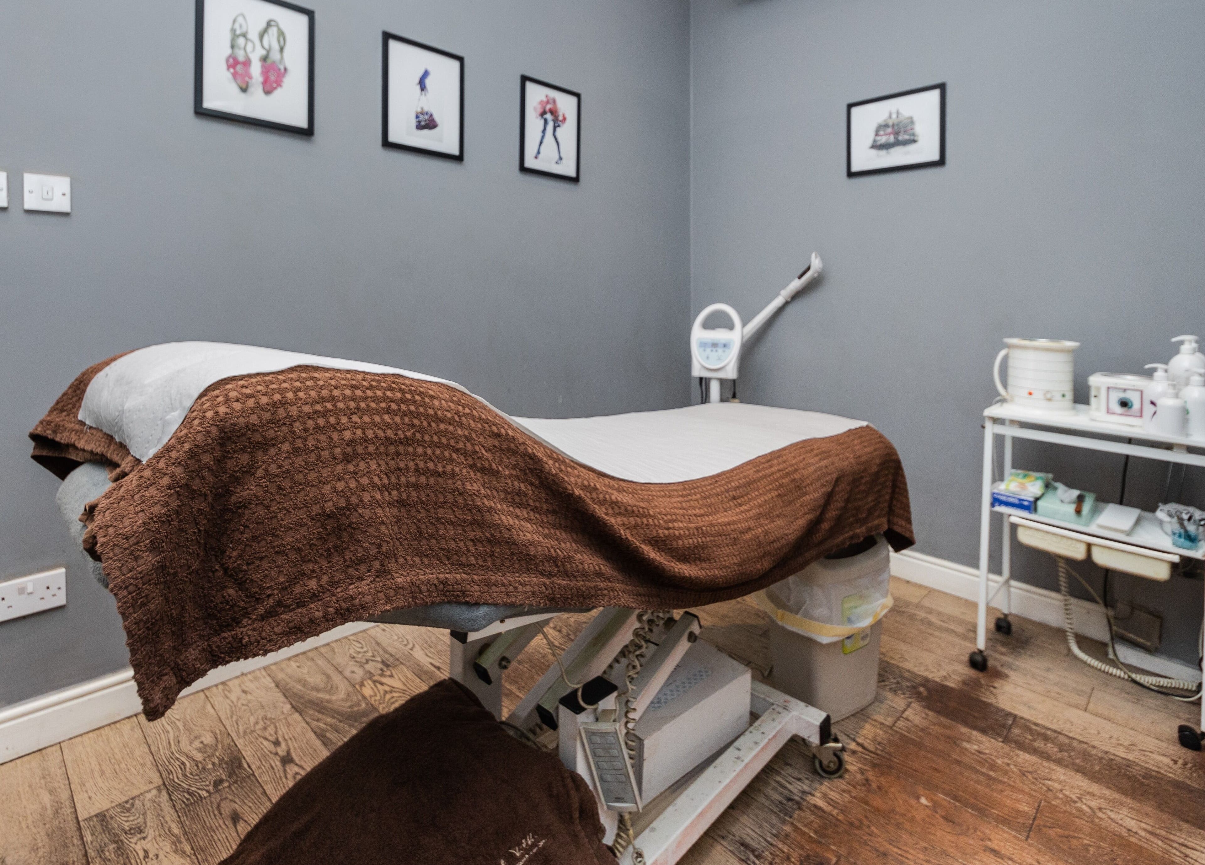 Calm treatment room at Brigita Vather, London, England, GB with a therapy bed and subtle decor.