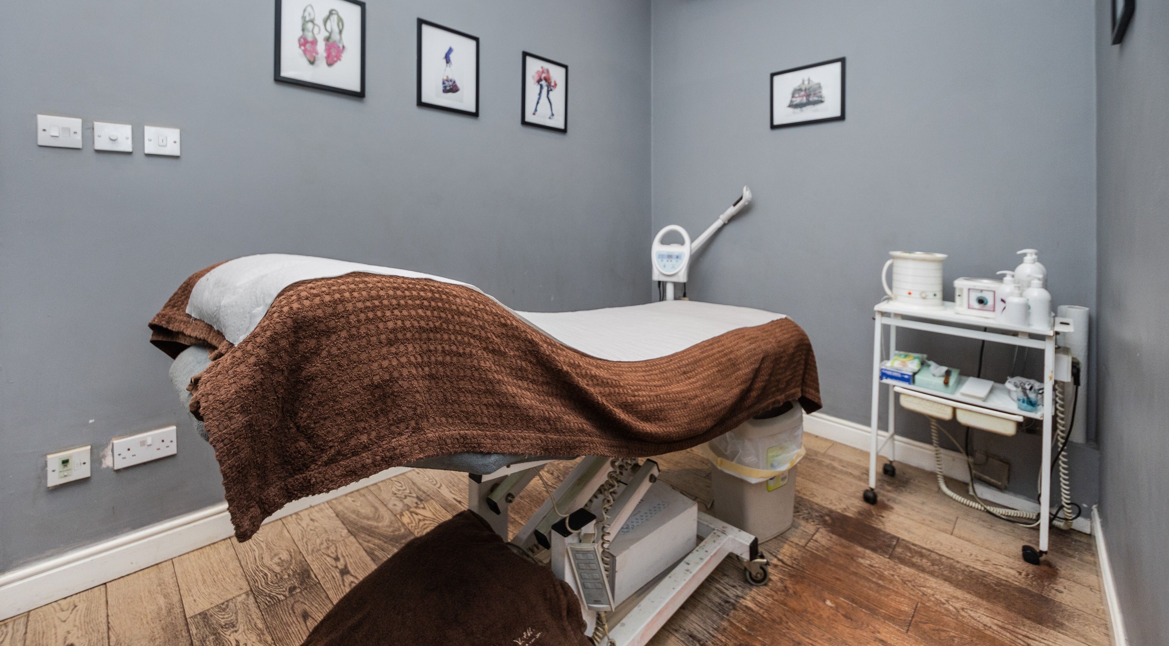 Calm treatment room at Brigita Vather, London, England, GB with a therapy bed and subtle decor.