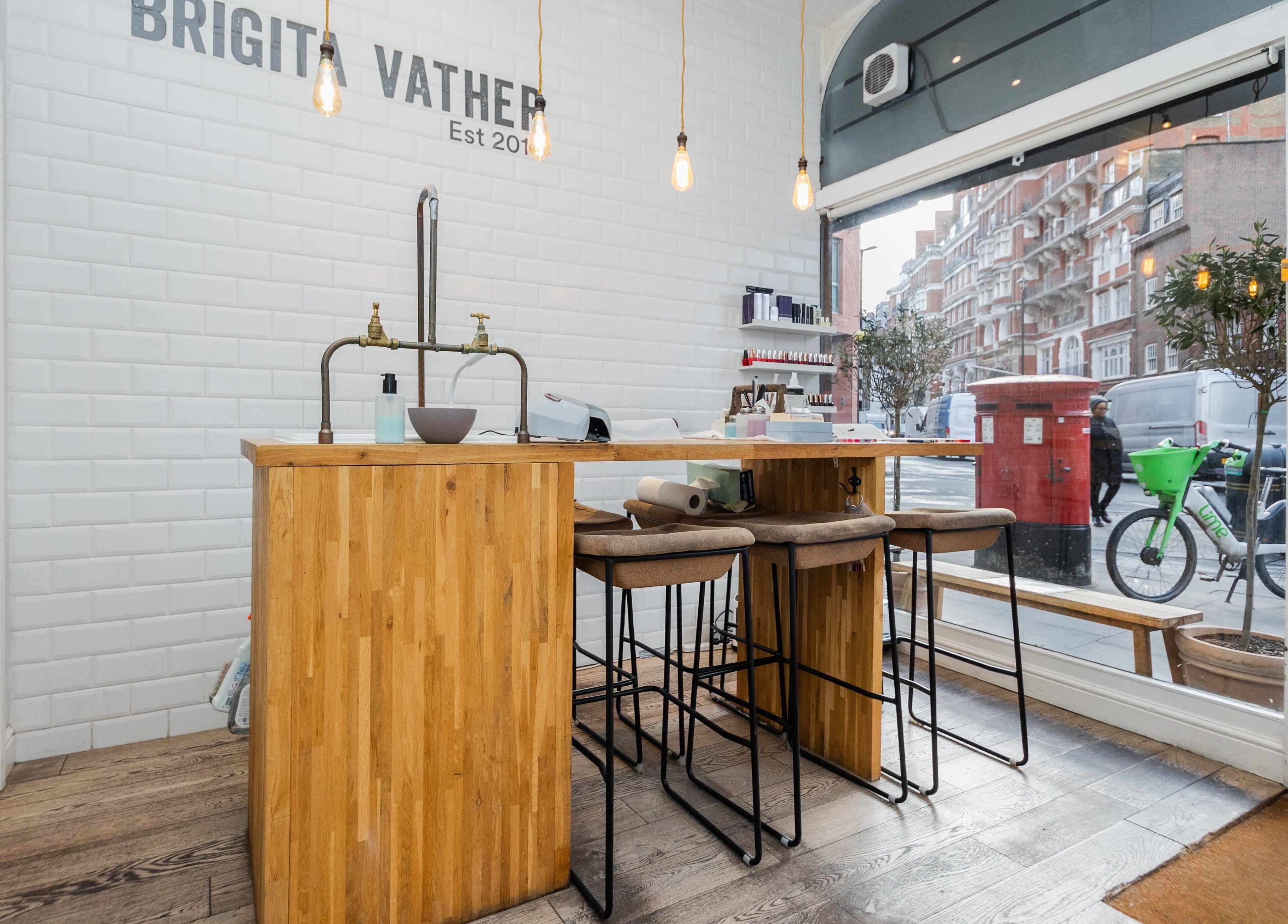 Elegant interior of Brigita Vather, featuring a stylish wooden counter in London, England, GB.