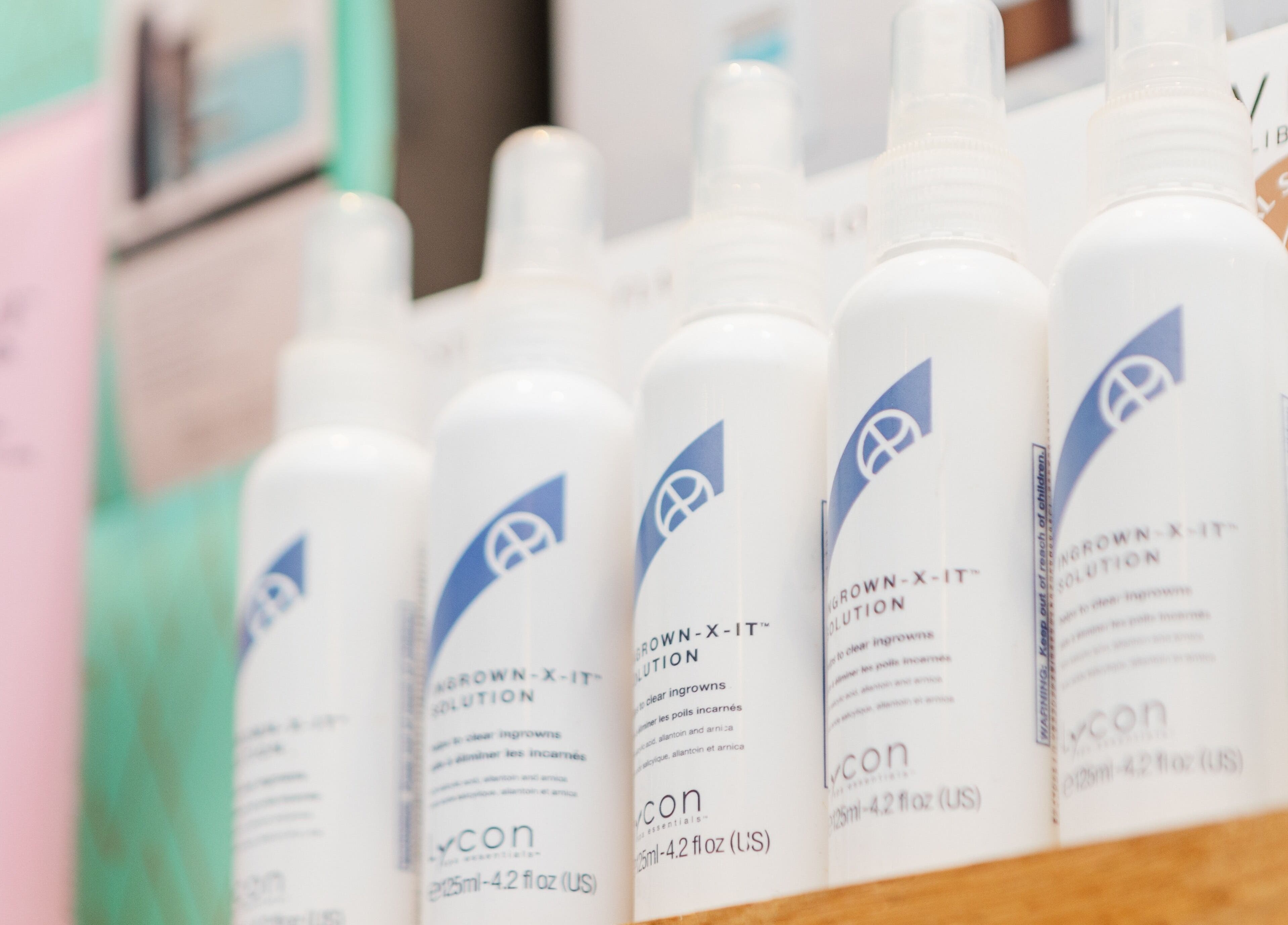 Line of beauty products on a shelf at Brigita Vather, London, England, GB, creating a serene shopping experience.