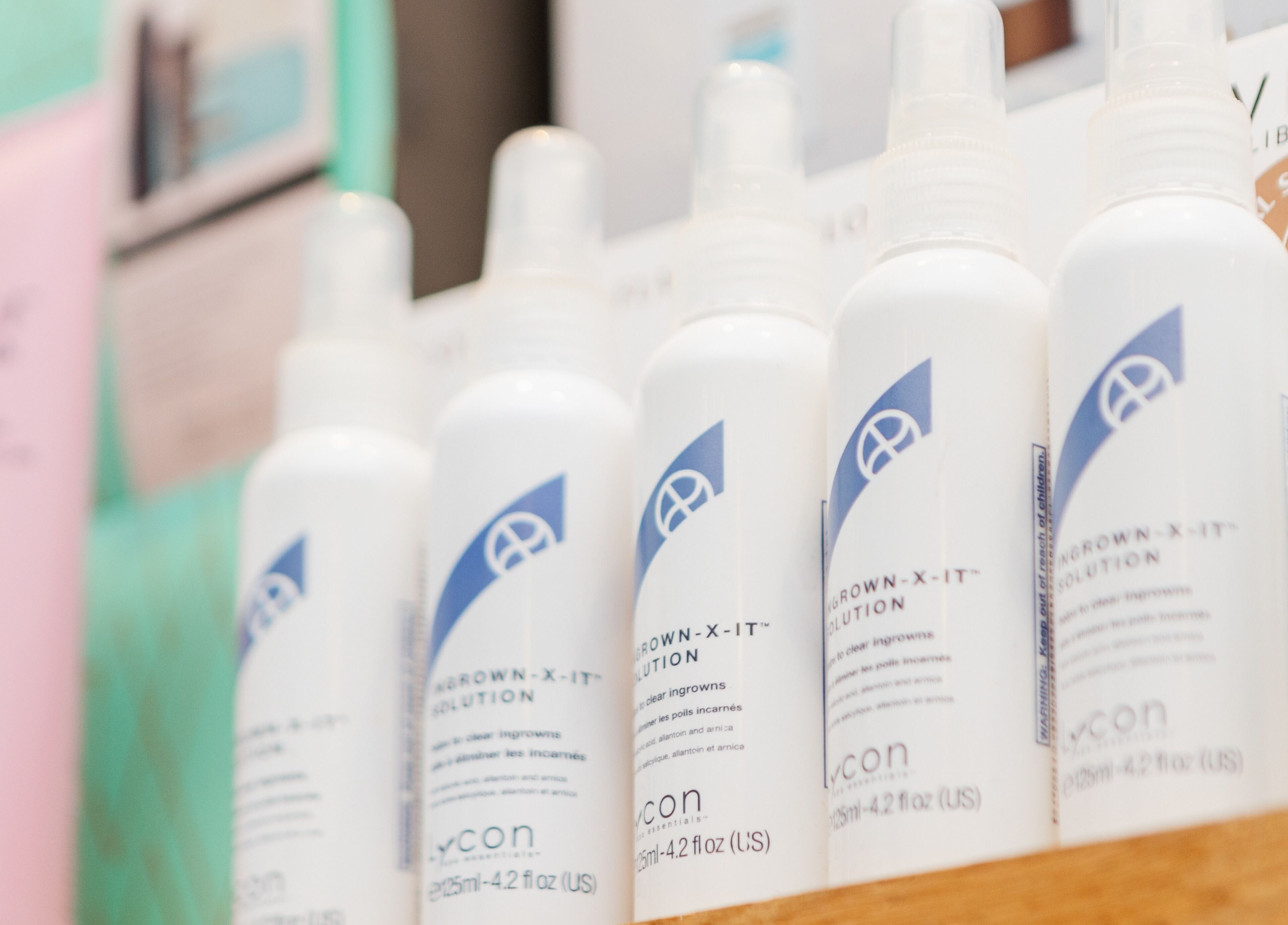 Line of beauty products on a shelf at Brigita Vather, London, England, GB, creating a serene shopping experience.