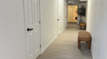 Tranquil hallway at Piko’s Spa, Sarasota, Florida, US, featuring modern decor and calming ambiance.