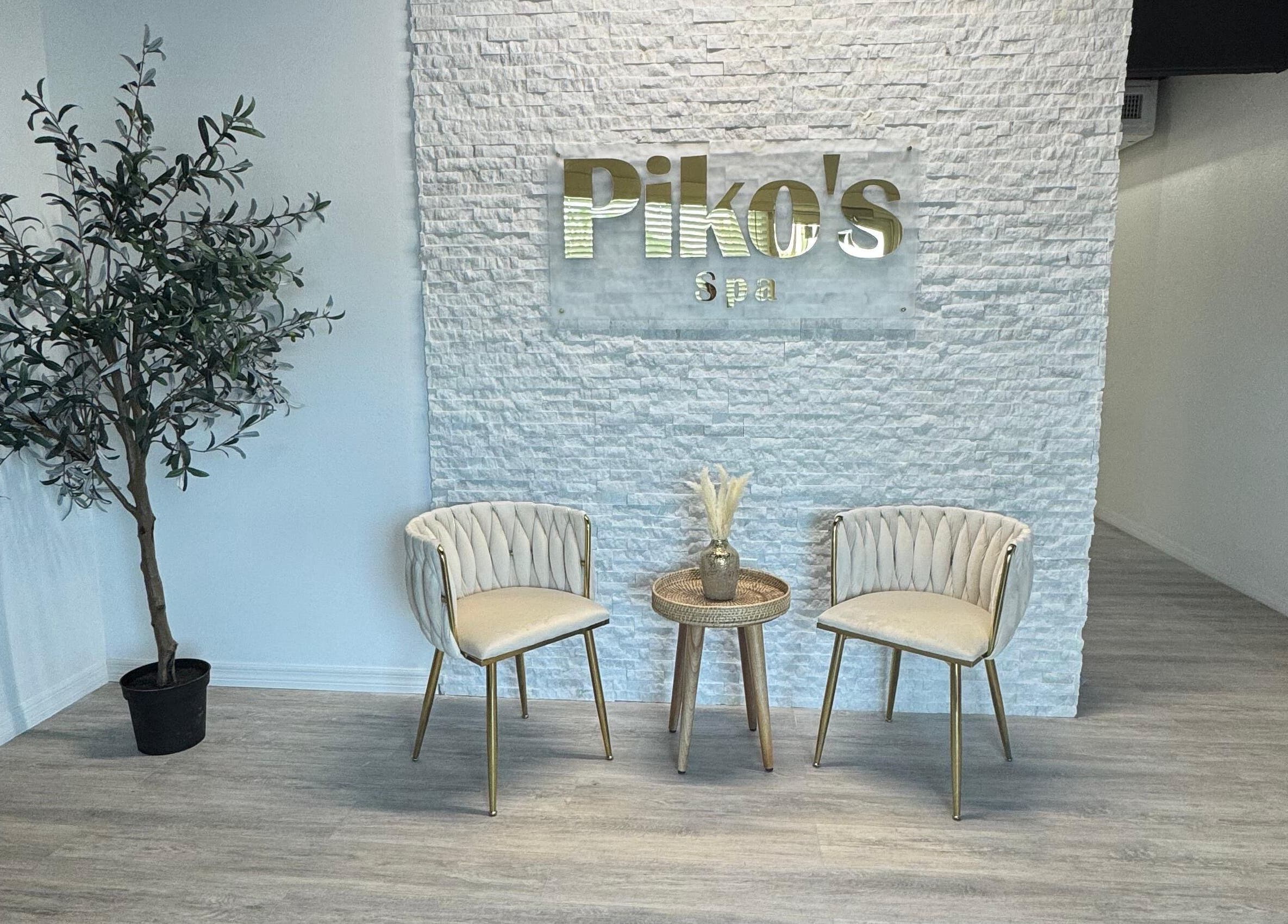 Elegant waiting area at Piko’s Spa in Sarasota, Florida, US with chairs and a plant for a calming ambiance.