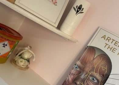 Decorative shelf with a floral display at KalliJayne Aesthetics in Margate, England, GB.