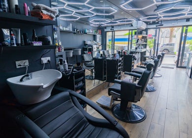 PLAN B | BALLUTA salon interior in Sliema, MT, showcasing stylish chairs and modern fixtures.