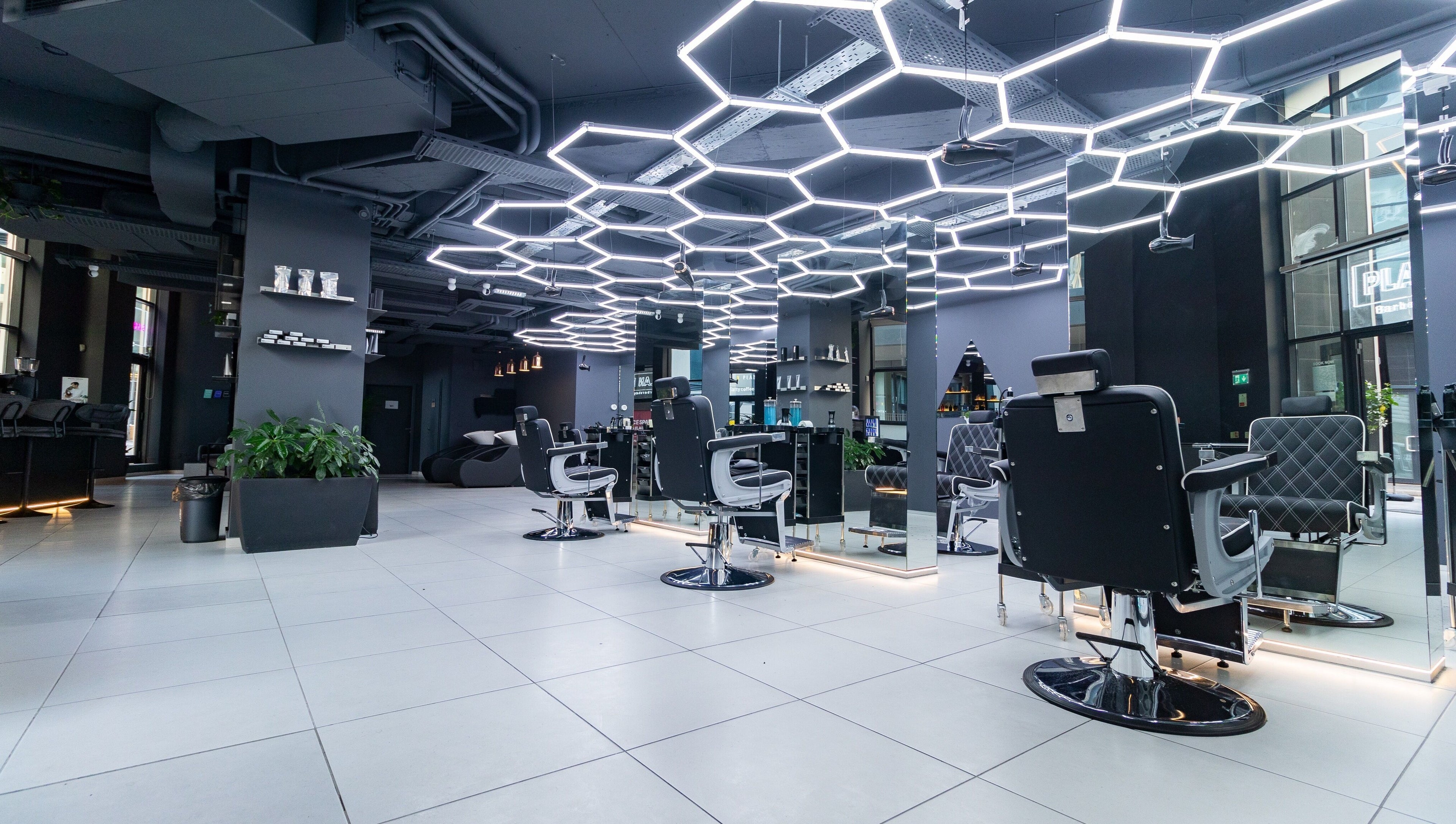 Modern salon interior at PLAN B | Mercury (St. Julian’s), San Ġiljan, MT with stylish chairs and lighting.