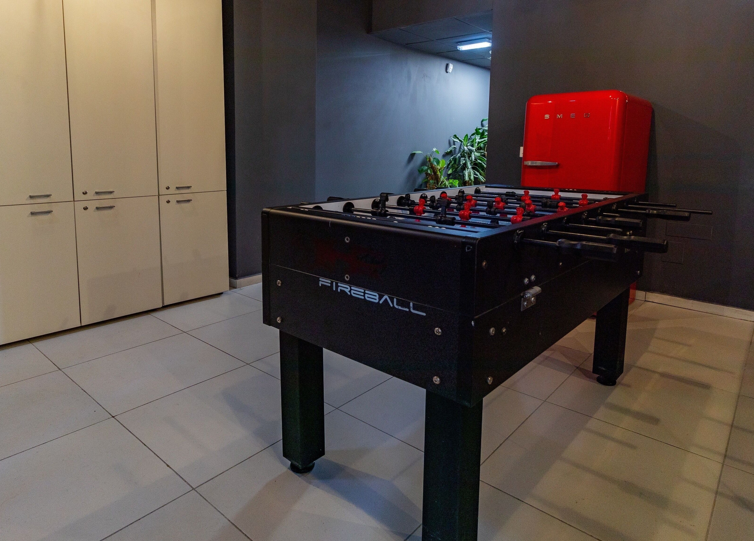 Stylish foosball table at PLAN B | Mercury (St. Julian’s), San Ġiljan, MT with sleek decor and vibrant ambiance.