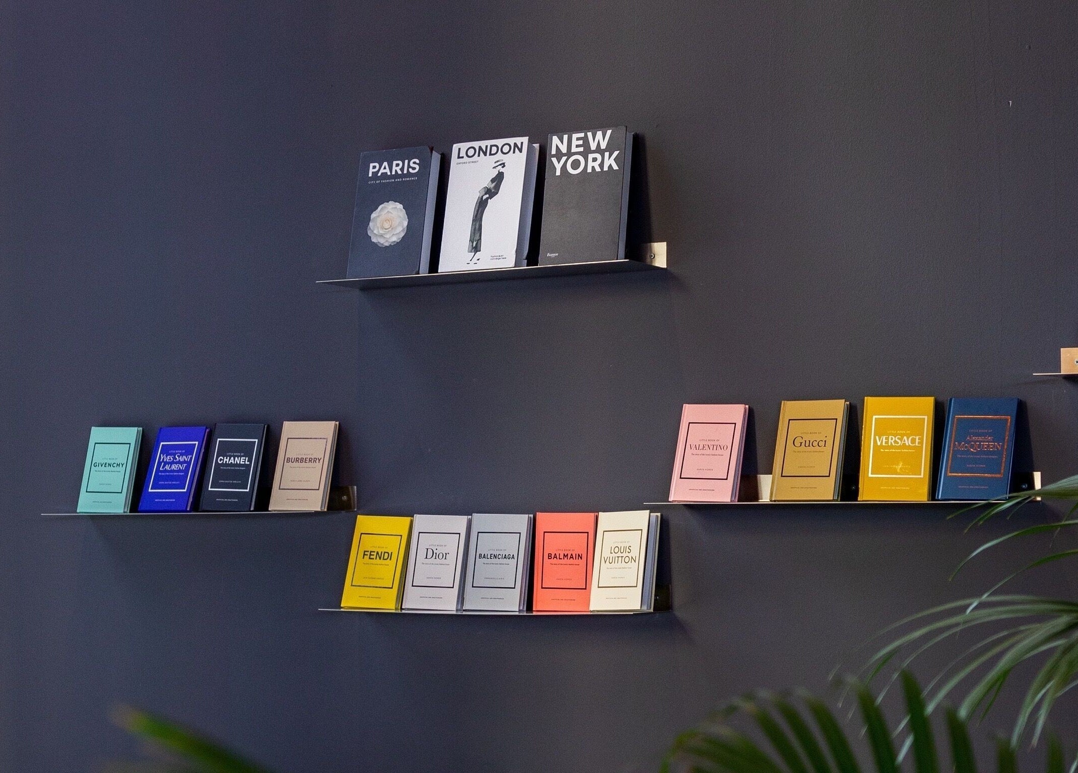 Stylish book display at PLAN B | Mercury (St. Julian’s), San Ġiljan, MT, featuring luxury brand themes.