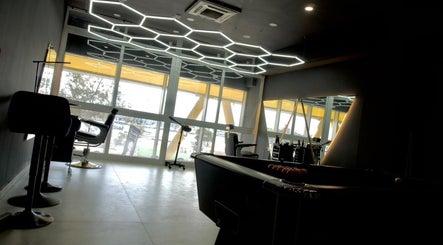 Spacious interior of PLAN B | THE STRAND in Tas-sliema, MT featuring sleek chairs and modern lighting design.