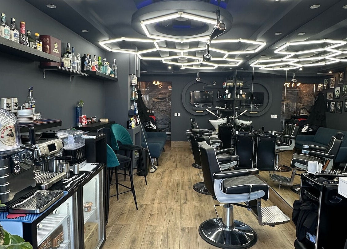 Modern salon interior at PLAN B | St. Paul’s, San Pawl Il-baħar, MT, showcasing stylish seating and decor.