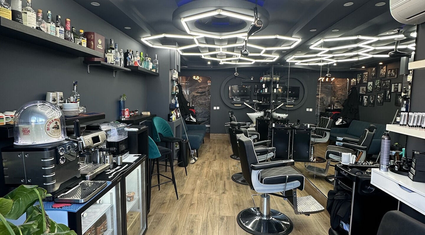 Modern salon interior at PLAN B | St. Paul’s, San Pawl Il-baħar, MT, showcasing stylish seating and decor.