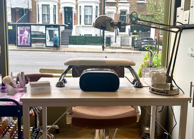 Manicure station at SetbyFloss, London, England, GB, featuring tools and supplies for perfect nails.