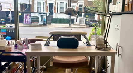 Manicure station at SetbyFloss, London, England, GB, featuring tools and supplies for perfect nails.
