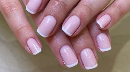 Elegant French manicure at SetbyFloss, London, England, GB. Perfectly polished nails showcased.