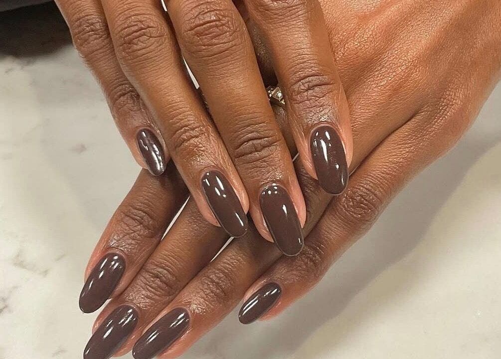 Beautiful brown manicure at SetbyFloss in London, England, GB, showcasing elegant nail care.