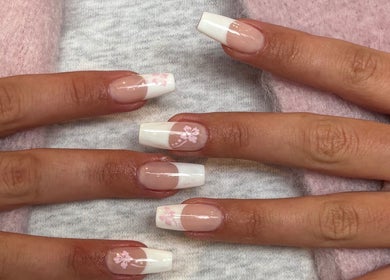 Elegant floral French manicure at SetbyFloss, London, England, GB, showcasing white tips and pink accents.