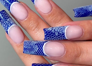 Elegant blue lace nails at SetbyFloss, London, England, GB showcasing intricate artistic design.