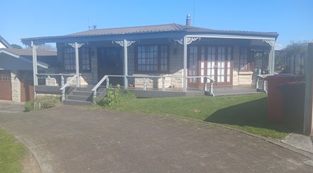 Inviting exterior of Massage Em, Morrinsville, Waikato, NZ, showcasing its cozy entrance and tranquil setting.