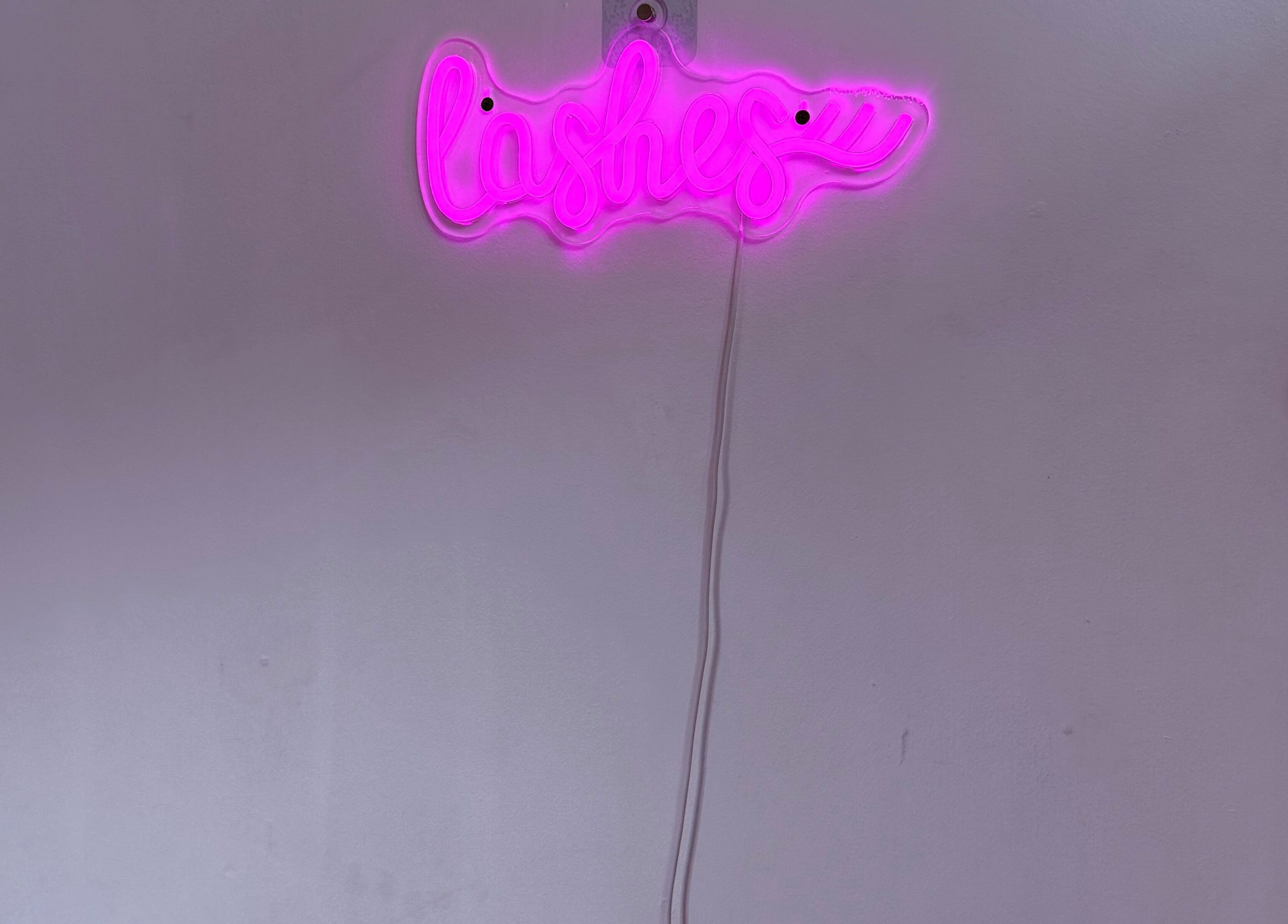 Pink neon 'Lashes' sign adds vibrant charm to Bai Beauty Bar, Kingston, St. Andrew Parish, JM.