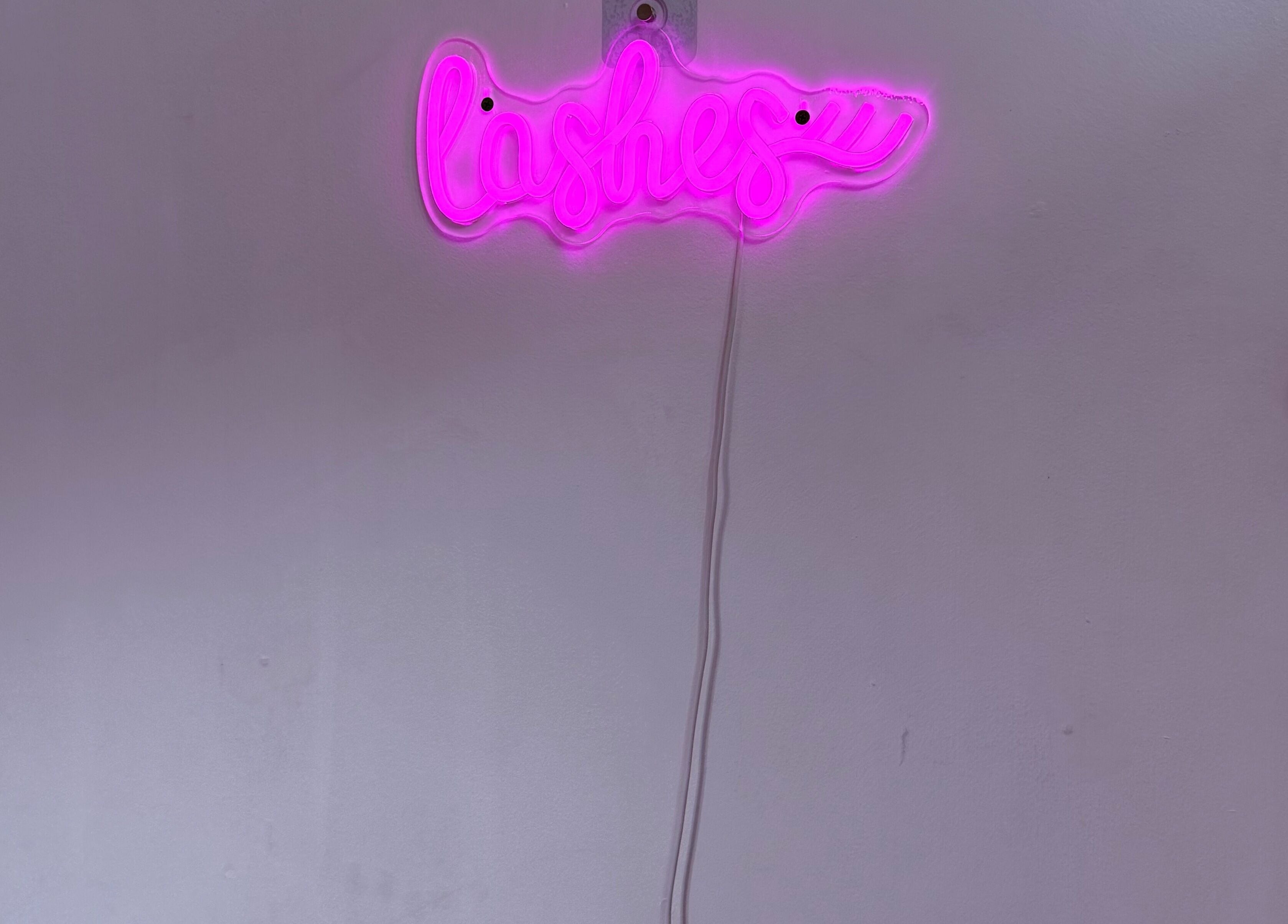 Pink neon 'Lashes' sign adds vibrant charm to Bai Beauty Bar, Kingston, St. Andrew Parish, JM.