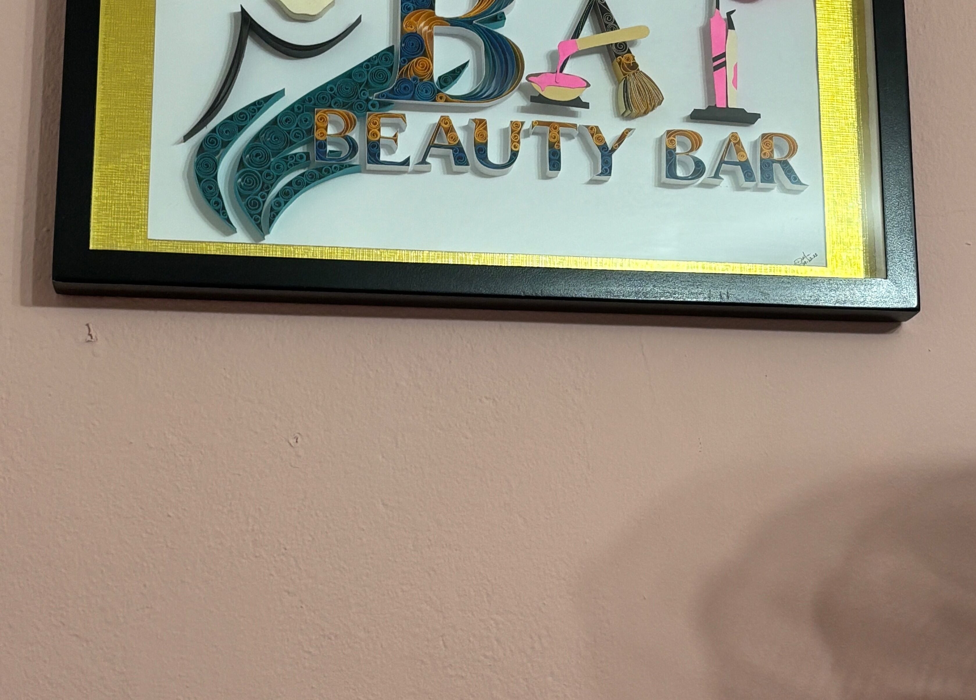 Artistic sign of Bai Beauty Bar, Kingston, St. Andrew Parish, JM, on a pink wall.