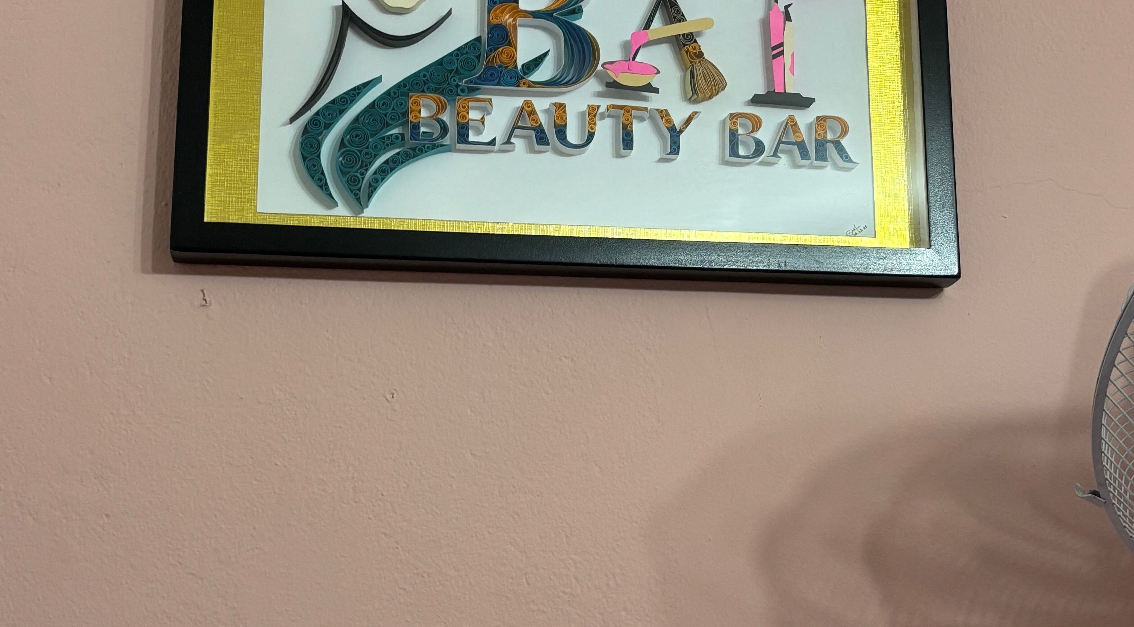 Artistic sign of Bai Beauty Bar, Kingston, St. Andrew Parish, JM, on a pink wall.
