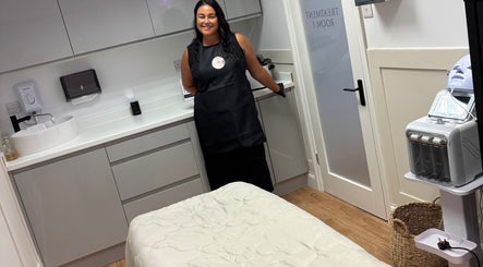 Modern treatment room at The Beauty Loft, Kirkby In Ashfield, England, GB, featuring sleek white cabinetry.