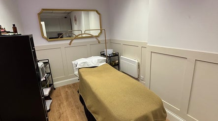 Tranquil treatment room at The Beauty Loft, Kirkby In Ashfield, England, GB. Elegant decor and massage table.