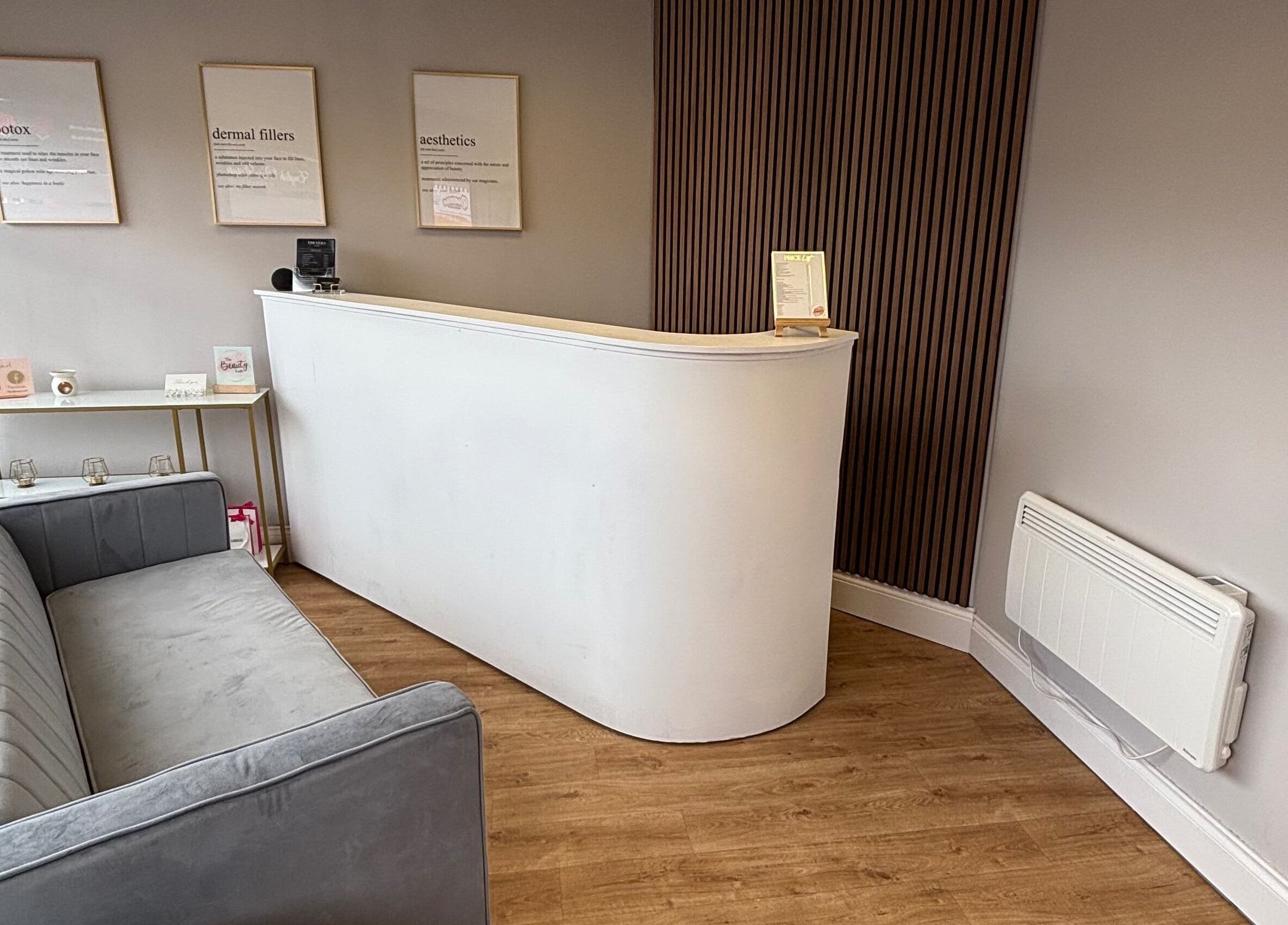 Sleek reception area at The Beauty Loft, Kirkby In Ashfield, England, GB with modern decor and cozy seating.