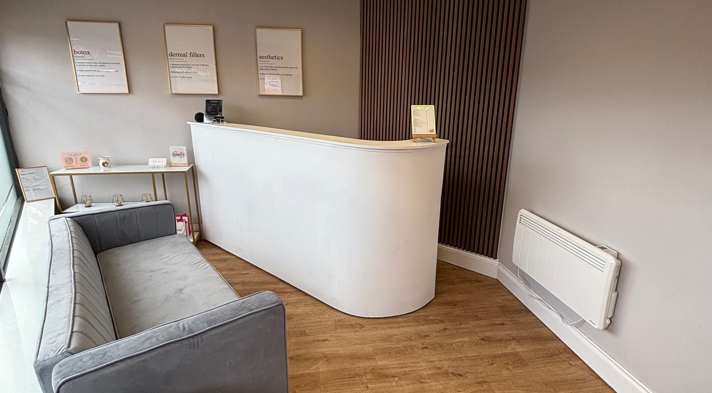Sleek reception area at The Beauty Loft, Kirkby In Ashfield, England, GB with modern decor and cozy seating.