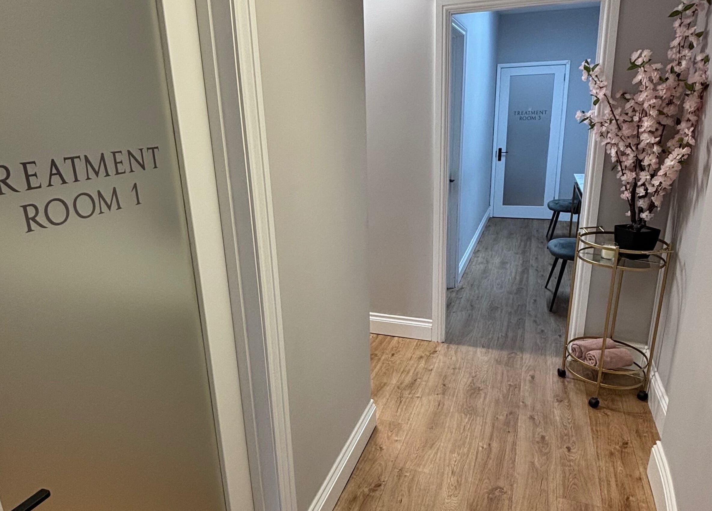 Treatment room hallway at The Beauty Loft, Kirkby In Ashfield, England, GB. Elegant decor and soft lighting.