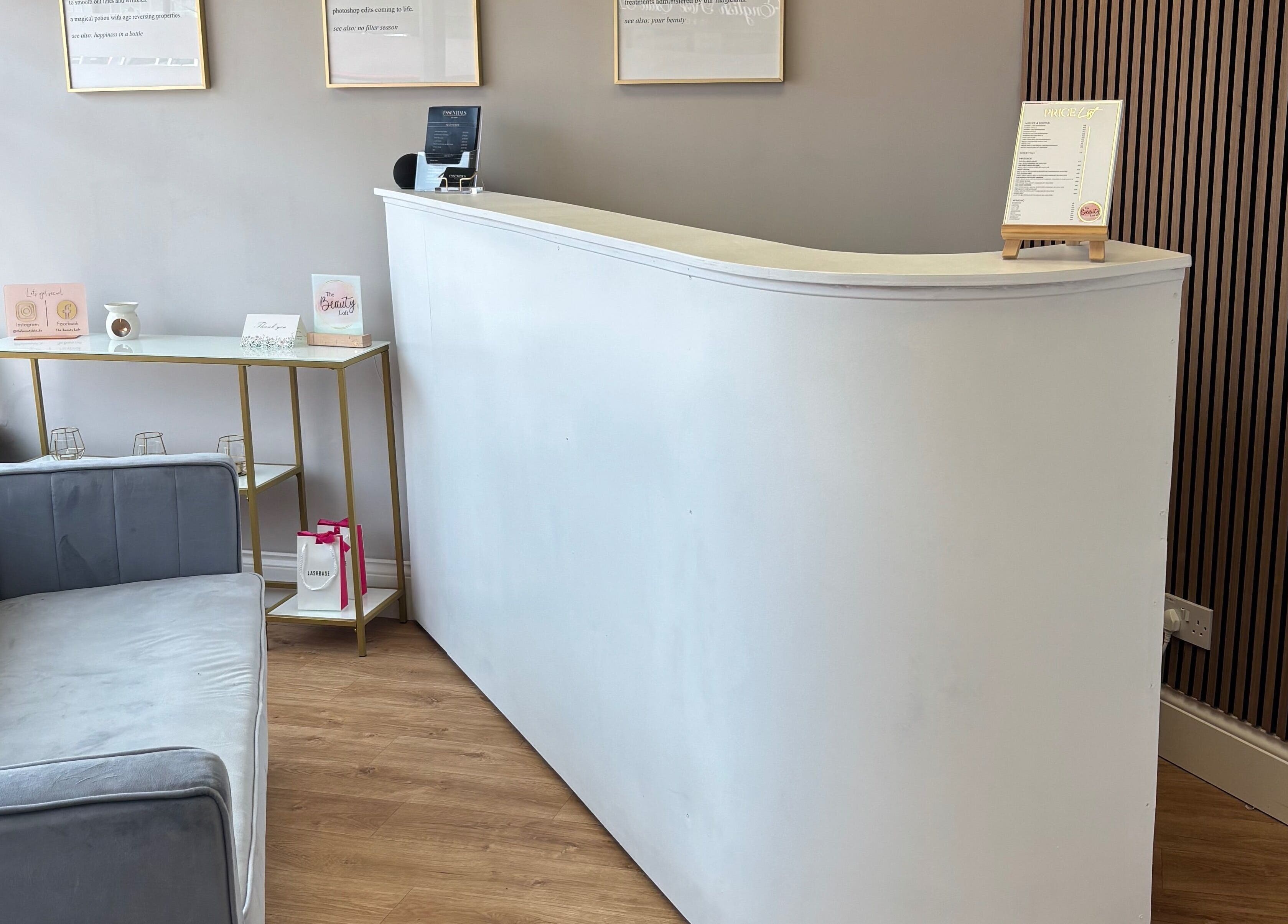 Stylish reception at The Beauty Loft, Kirkby In Ashfield, England, GB with modern decor and comfortable seating.