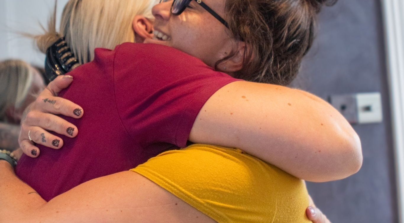 Warm embrace at Charlie’s Lash and Beauty Bar, Plymouth, England, GB showcasing customer care.