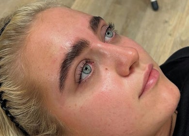 Client displaying freshly styled eyebrows at Henley House, Henley-in-Arden, England, GB.