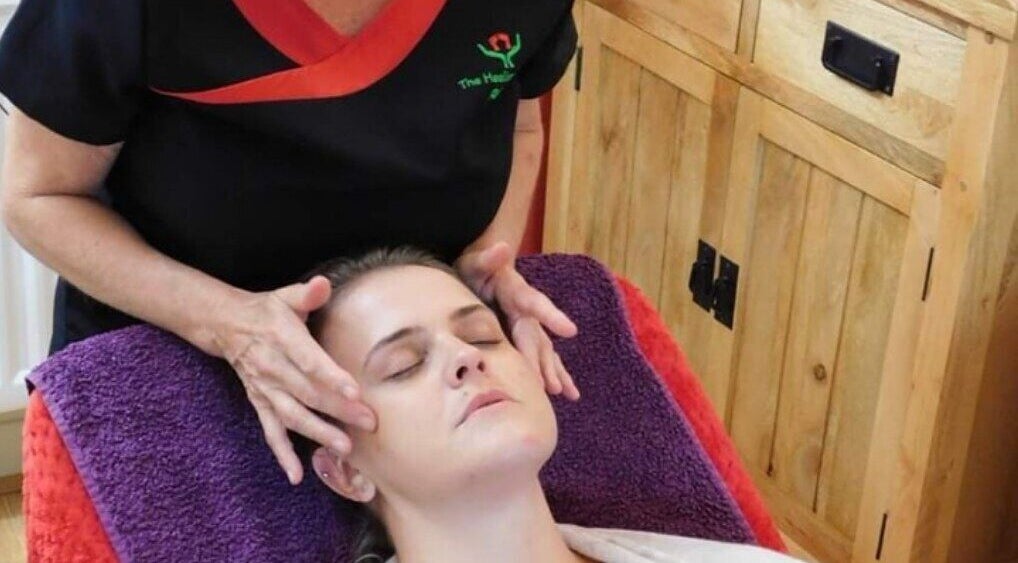 Relaxing head massage at The Heeling Feeling Reflexology, Cheltenham, England, GB, promoting tranquility and well-being.